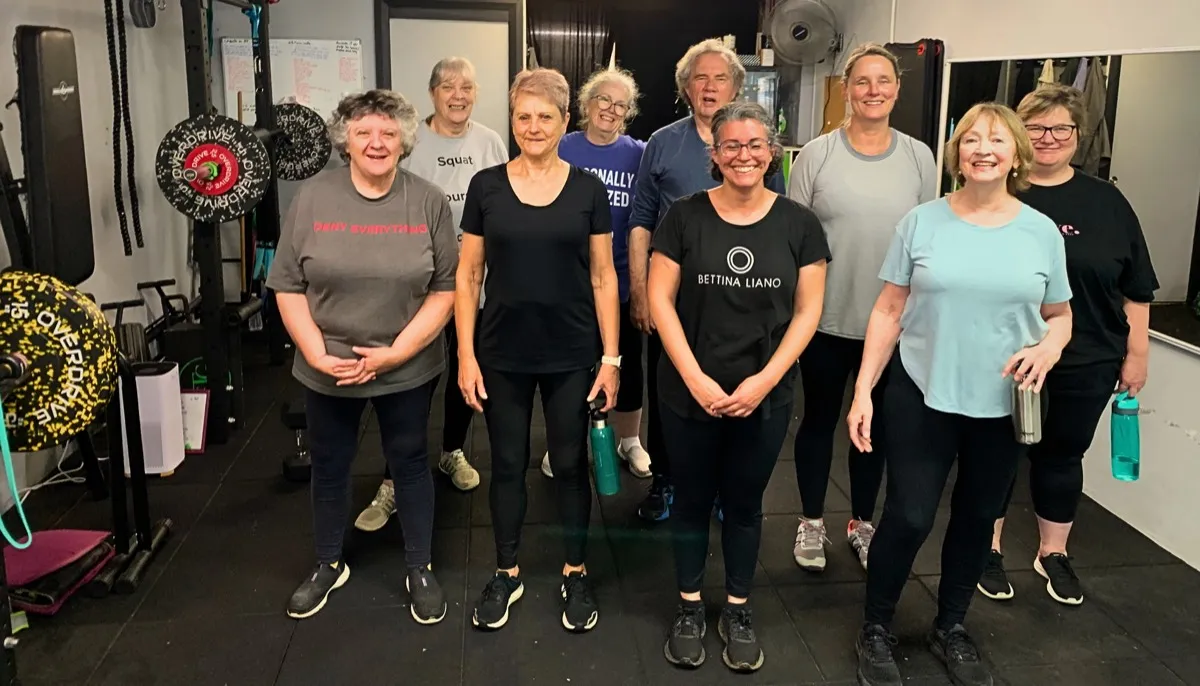 A group of women from the studio standing together, smiling.